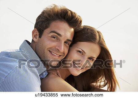 Stock Photography - Portrait of smiling couple . Fotosearch