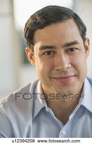 Portrait of smiling male executive in office View Large Photo Image Stock Photo - Portrait of smiling male executive in office. Fotosearch