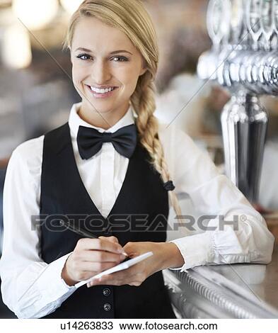Portrait of smiling waitress View Large Photo Image Stock Image - Portrait of smiling waitress. Fotosearch