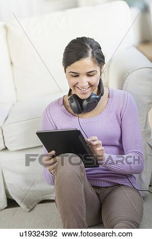Portrait of teenage girl (16-17) with digital tablet and headphones View Large Photo Image Stock Image - Portrait of teenage girl (16-17) with digital tablet and headphones. Fotosearch