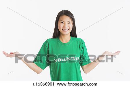 Portrait of teenage girl ( 16-17 years) wearing green t-shirt View Large Photo Image Stock Image - Portrait of teenage girl ( 16-17 years) wearing green t-shirt. Fotosearch