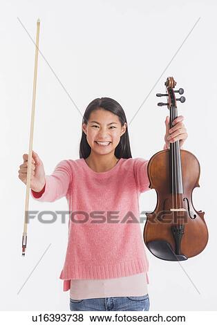 Portrait of teenage girl( 16-17 years) holding violin View Large Photo Image Stock Photo - Portrait of teenage girl( 16-17 years) holding violin. Fotosearch