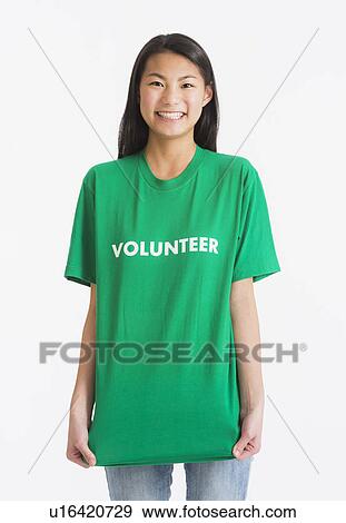 Portrait of teenage girl ( 16-17 years) wearing green t-shirt View Large Photo Image Stock Photo - Portrait of teenage girl ( 16-17 years) wearing green t-shirt. Fotosearch