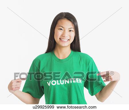 Portrait of teenage girl ( 16-17 years) wearing green t-shirt View Large Photo Image Stock Photo - Portrait of teenage girl ( 16-17 years) wearing green t-shirt. Fotosearch
