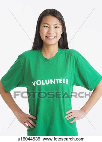 Stock Photograph - Portrait of teenage girl ( 16-17 years) wearing green t-shirt. Fotosearch