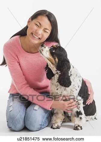 Portrait of teenage girl ( 16-17 years) with dog View Large Photo Image Stock Photography - Portrait of teenage girl ( 16-17 years) with dog. Fotosearch