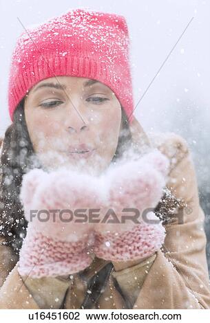 Portrait of woman blowing snow from hands View Large Photo Image Stock Image - Portrait of woman blowing snow from hands. Fotosearch
