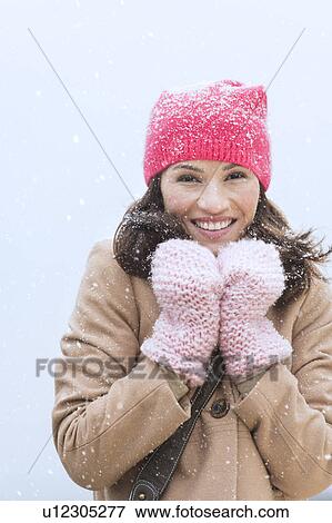 Stock Photo - Portrait of woman in winter clothes. Fotosearch