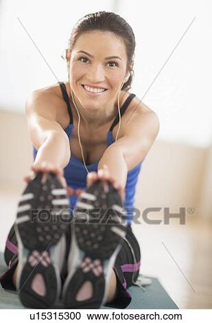 Portrait of woman stretching in gym View Large Photo Image Stock Image - Portrait of woman stretching in gym. Fotosearch