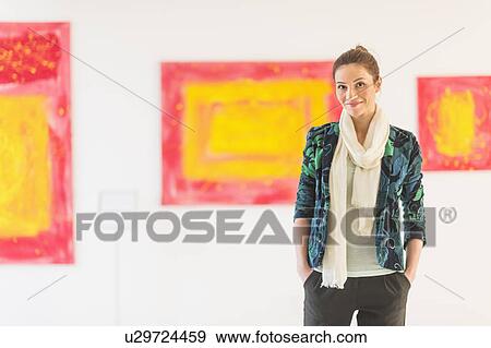Portrait of woman with paintings in museum View Large Photo Image Stock Photo - Portrait of woman with paintings in museum. Fotosearch