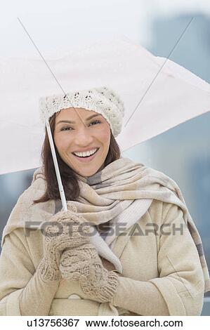 Portrait of woman with umbrella View Large Photo Image Stock Photo - Portrait of woman with umbrella. Fotosearch