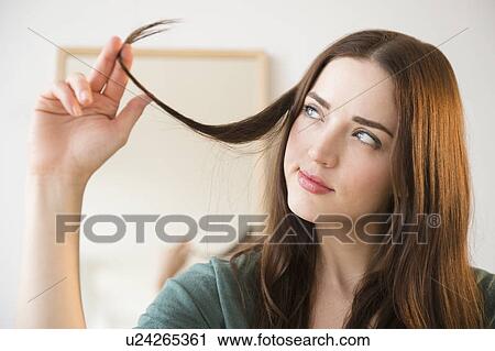 Stock Image - Portrait of young attractive woman. Fotosearch