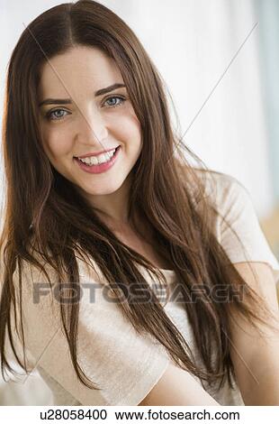 Stock Image - Portrait of young attractive woman. Fotosearch
