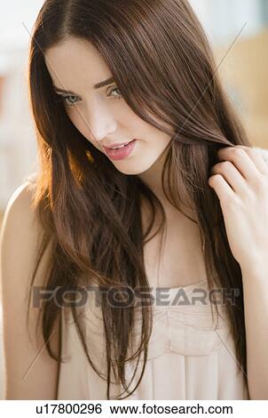Stock Photograph - Portrait of young attractive woman. Fotosearch