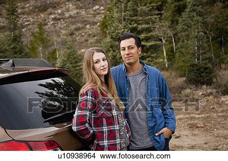 Picture - Portrait of young couple during road trip. Fotosearch