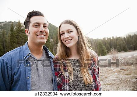 Portrait of young couple in non-urban scene View Large Photo Image Picture - Portrait of young couple in non-urban scene. Fotosearch