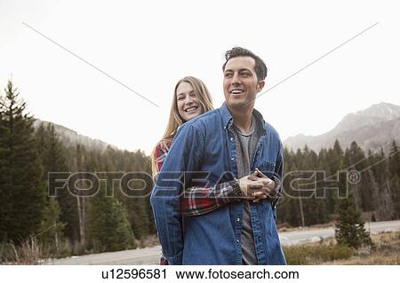 Portrait of young couple in non-urban scene View Large Photo Image Stock Image - Portrait of young couple in non-urban scene. Fotosearch