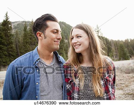 Portrait of young couple in non-urban scene View Large Photo Image Stock Image - Portrait of young couple in non-urban scene. Fotosearch