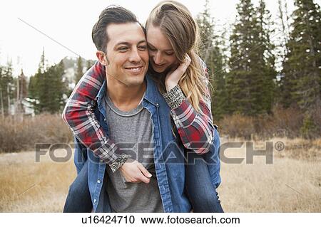 Portrait of young couple in non-urban scene View Large Photo Image Stock Image - Portrait of young couple in non-urban scene. Fotosearch