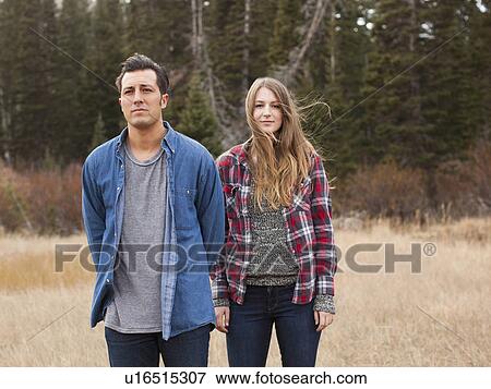 Stock Photo - Portrait of young people in non-urban scene. Fotosearch