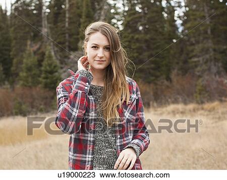 Portrait of young woman in non-urban scene View Large Photo Image Stock Image - Portrait of young woman in non-urban scene. Fotosearch