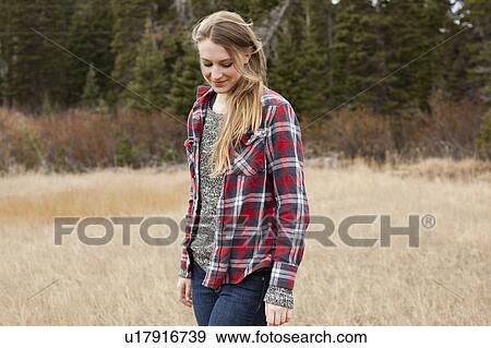 Portrait of young woman in non-urban scene View Large Photo Image Stock Photo - Portrait of young woman in non-urban scene. Fotosearch