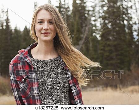 Portrait of young woman in non-urban scene View Large Photo Image Stock Photography - Portrait of young woman in non-urban scene. Fotosearch