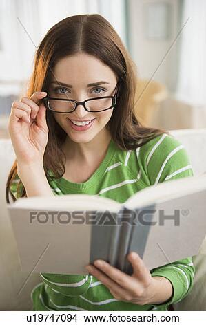 Portrait of young woman in reading glasses View Large Photo Image Picture - Portrait of young woman in reading glasses. Fotosearch