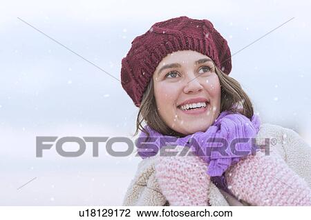 Portrait of young woman wearing knit hat, gloves and scarf View Large Photo Image Stock Image - Portrait of young woman wearing knit hat, gloves and scarf. Fotosearch