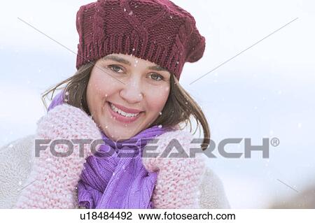 Portrait of young woman wearing knit hat, gloves and scarf View Large Photo Image Stock Image - Portrait of young woman wearing knit hat, gloves and scarf. Fotosearch