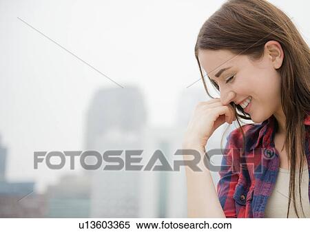 Portrait of young woman with city skyline in background View Large Photo Image Stock Photography - Portrait of young woman with city skyline in background. Fotosearch
