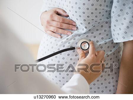 Pregnant woman during examination View Large Photo Image Stock Image - Pregnant woman during examination. Fotosearch