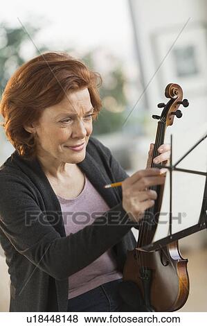 Senior woman composing music View Large Photo Image Stock Photo - Senior woman composing music. Fotosearch