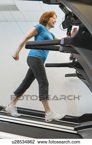 Senior woman on treadmill View Large Photo Image Stock Image - Senior woman on treadmill. Fotosearch