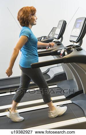 Senior woman on treadmill View Large Photo Image Stock Photo - Senior woman on treadmill. Fotosearch
