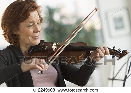 Senior woman playing violin View Large Photo Image Stock Photo - Senior woman playing violin. Fotosearch