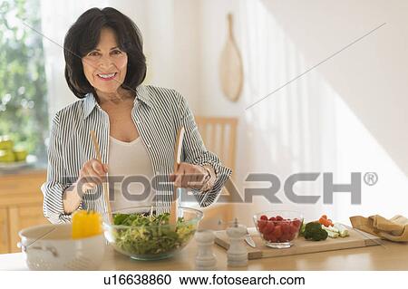 Senior woman preparing salad View Large Photo Image Stock Image - Senior woman preparing salad. Fotosearch