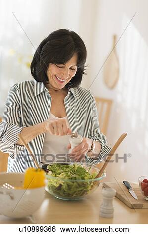 Senior woman preparing salad View Large Photo Image Stock Photograph - Senior woman preparing salad. Fotosearch