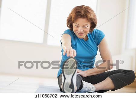 Senior woman stretching View Large Photo Image Stock Image - Senior woman stretching. Fotosearch