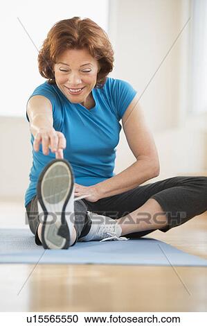 Senior woman stretching View Large Photo Image Stock Image - Senior woman stretching. Fotosearch
