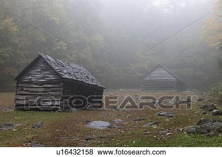 Stock Photo - Sheds in foggy glade. Fotosearch