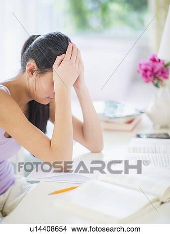 Picture - Side view of teenage girl (16-17 years) studding. Fotosearch
