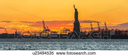 Silhouette of Statue of Liberty at sunset View Large Photo Image Stock Photography - Silhouette of Statue of Liberty at sunset. Fotosearch