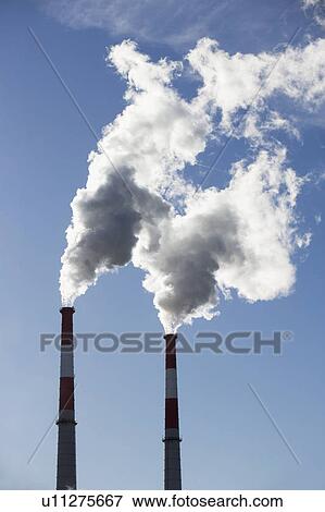 Stock Photo - Smoke emitting from smoke stacks. Fotosearch
