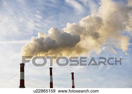 Smoke emitting from smoke stacks View Large Photo Image Stock Photo - Smoke emitting from smoke stacks. Fotosearch