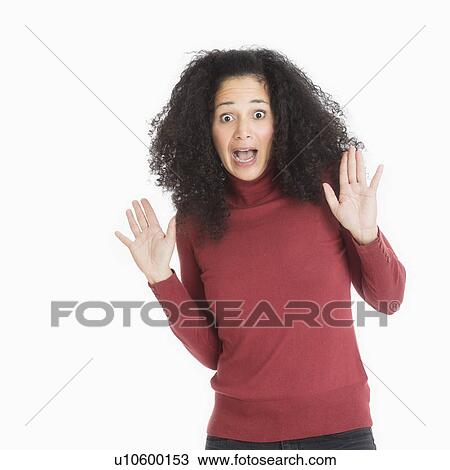 Stock Image - Studio portrait of mid adult woman. Fotosearch