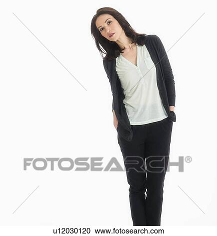 Stock Image - Studio portrait of mid adult woman. Fotosearch