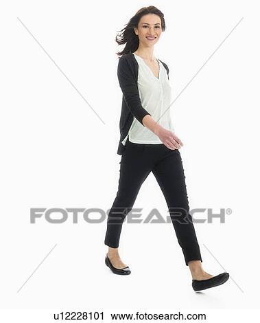 Stock Image - Studio portrait of mid adult woman. Fotosearch