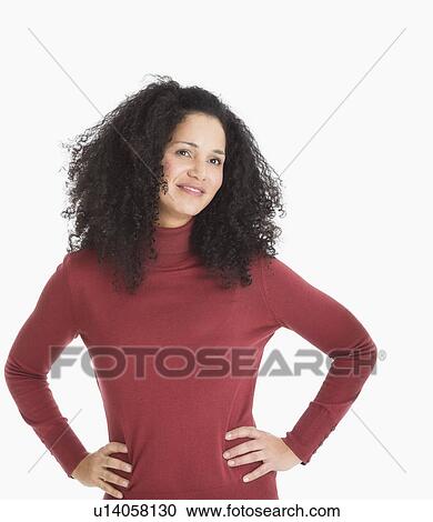 Stock Image - Studio portrait of mid adult woman. Fotosearch