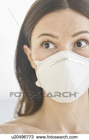 Studio portrait of woman wearing flu mask View Large Photo Image Stock Image - Studio portrait of woman wearing flu mask. Fotosearch